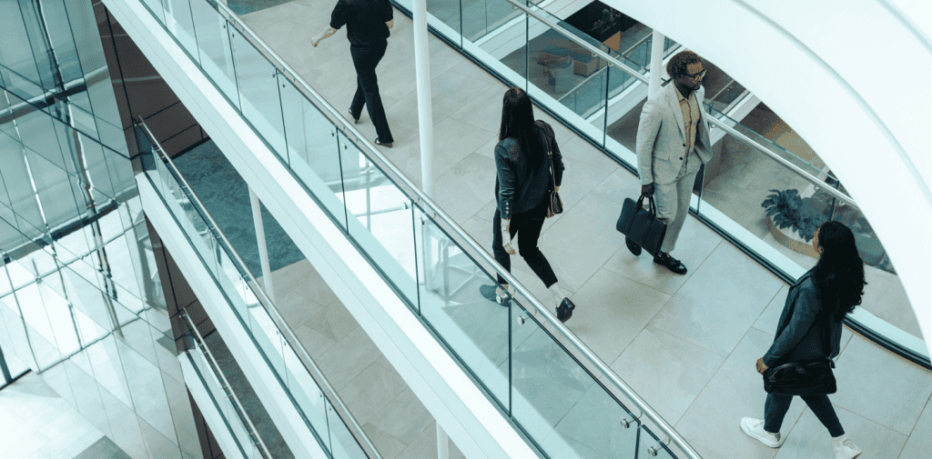 business people walking contemporary office compressed