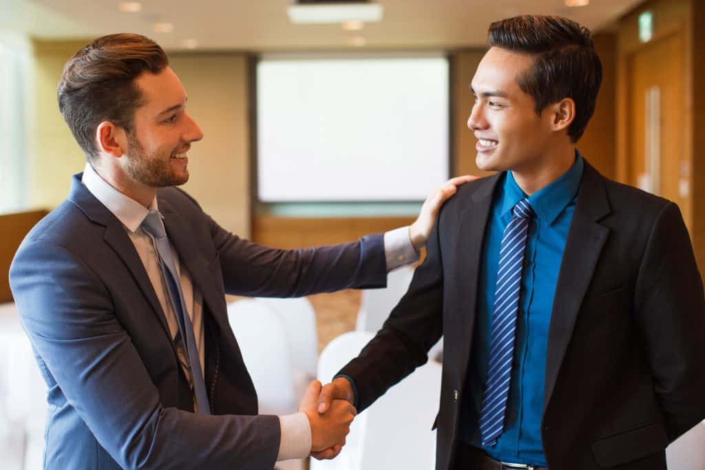 two men shaking hands compressed